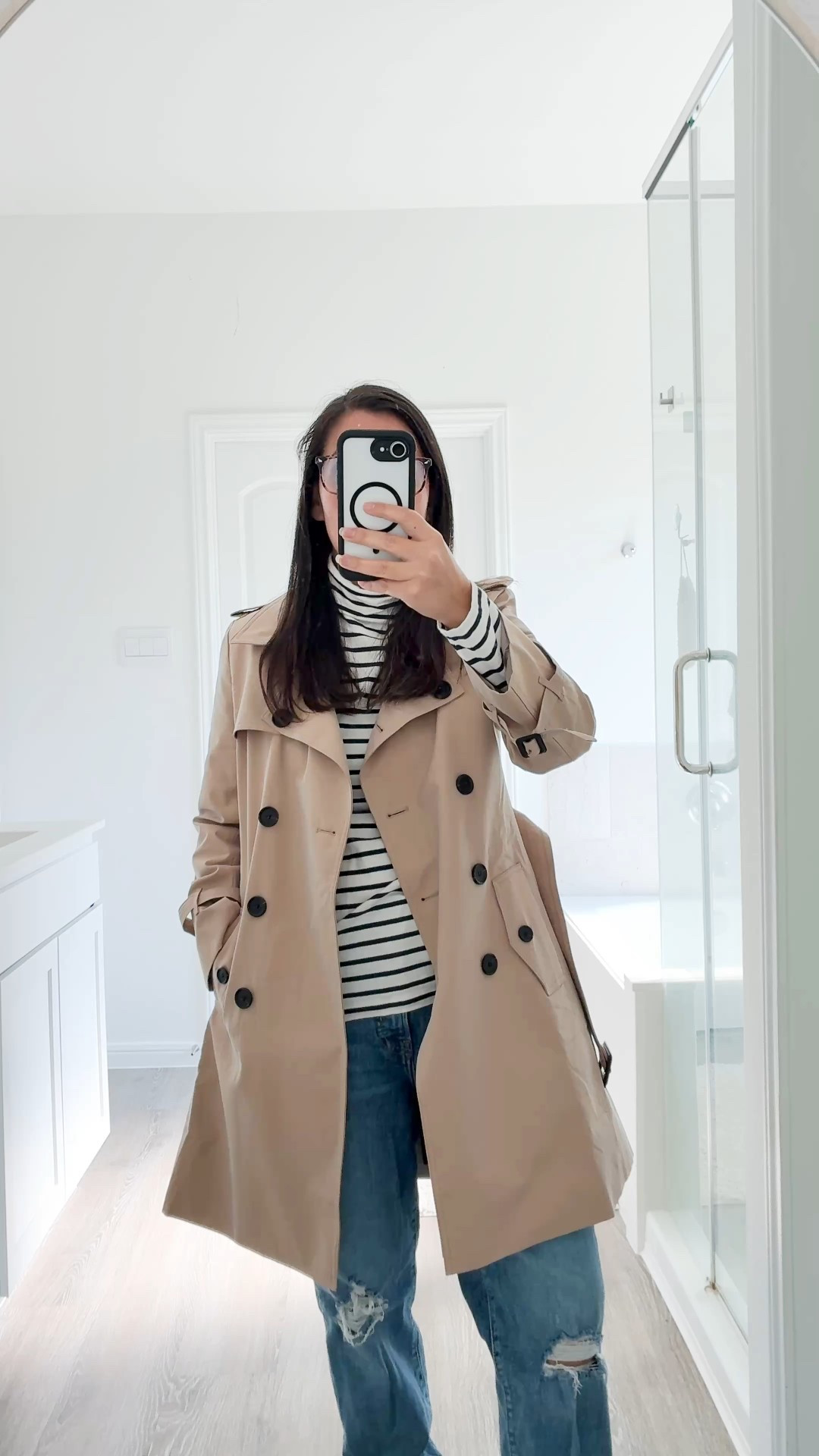Trench coat with striped turtleneck paired with casual jeans and tan boots. This outfit is comfy and classic. It also mixes high and low. 

#LTKPetite