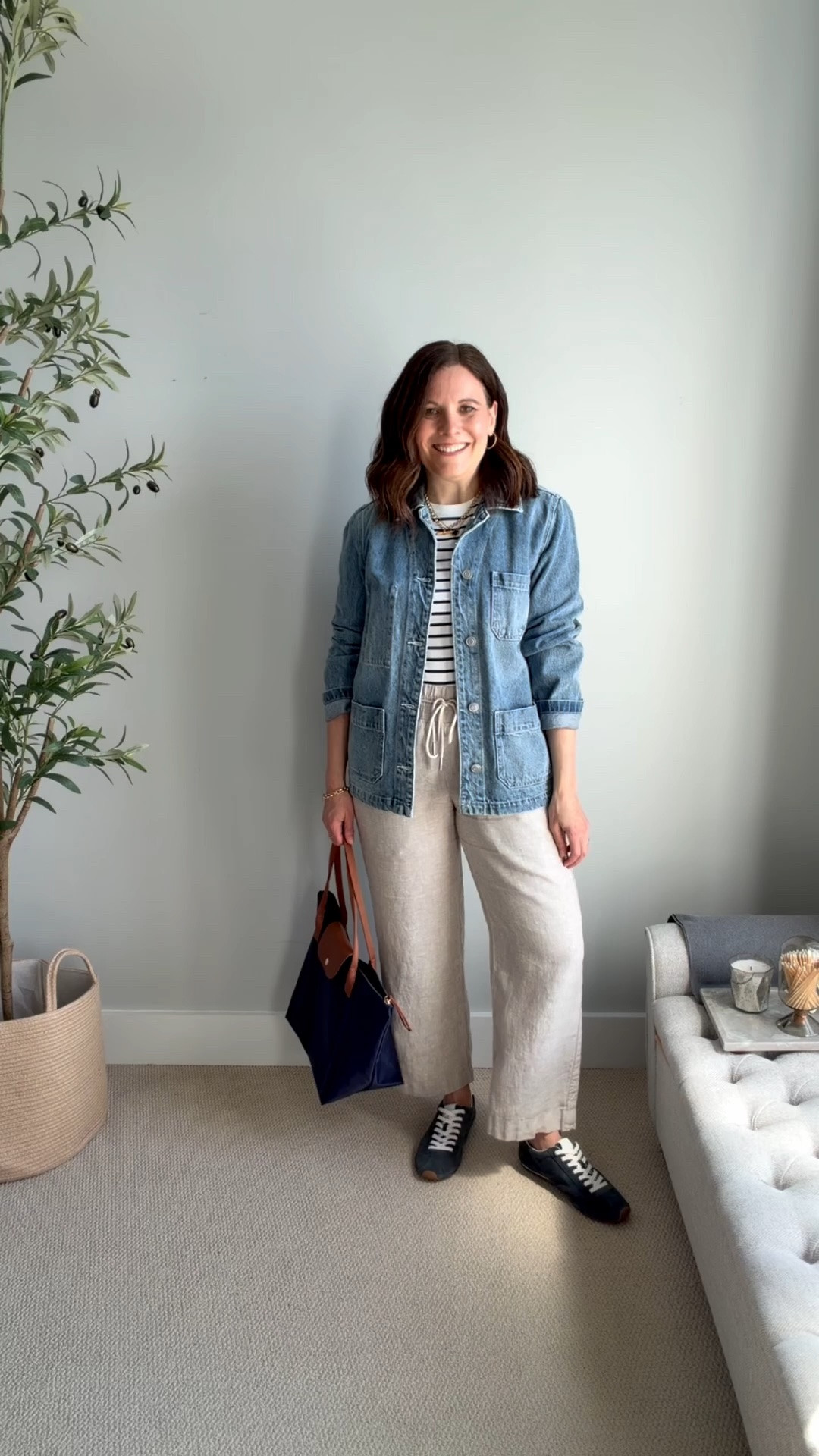 I love a striped tee with khaki linen pants. This version has long sleeves for a cooler day, but you could easily swap in a short-sleeve version.
I layered a denim utility jacket over the top and finished the look with navy sneakers and a matching tote. I love the big front pockets on this jacket; they’re perfect for your phone. These khaki linen wide leg pants fit true to size. I’m in a medium in the 28 inch inseam. ￼

#LTKSaleAlert #LTKMidsize #LTKOver40