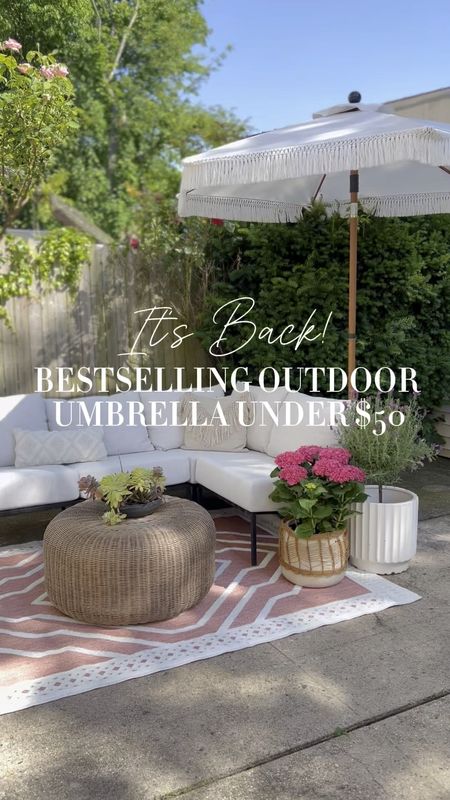 Our Bestselling outdoor umbrella is back!! I have three in the white. (They look grey on the website but they are white.) also comes in black! You guys sold it out last year!

#LTKhome #LTKfindsunder50