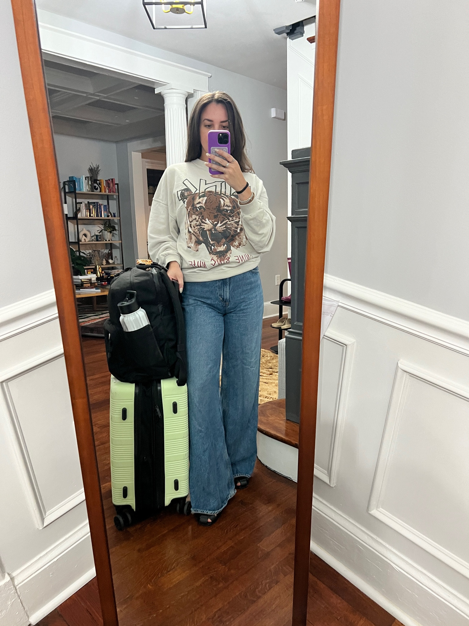 Anine Bing. Sweatshirt. Wide leg jeans. Travel style. 

#LTKStyleTip #LTKSeasonal #LTKTravel