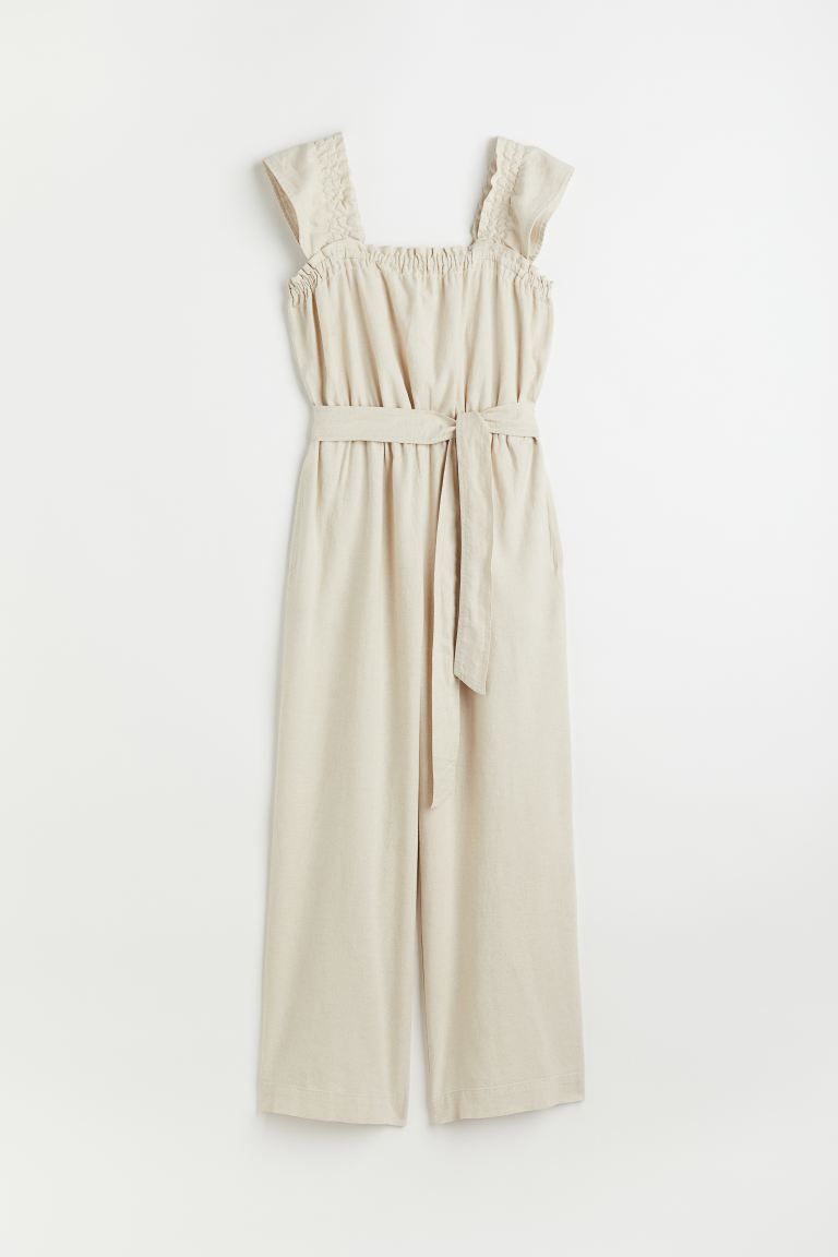 Sleeveless jumpsuit in an airy, woven linen and viscose blend. Wide, elasticized shoulder straps ... | H&M (US)