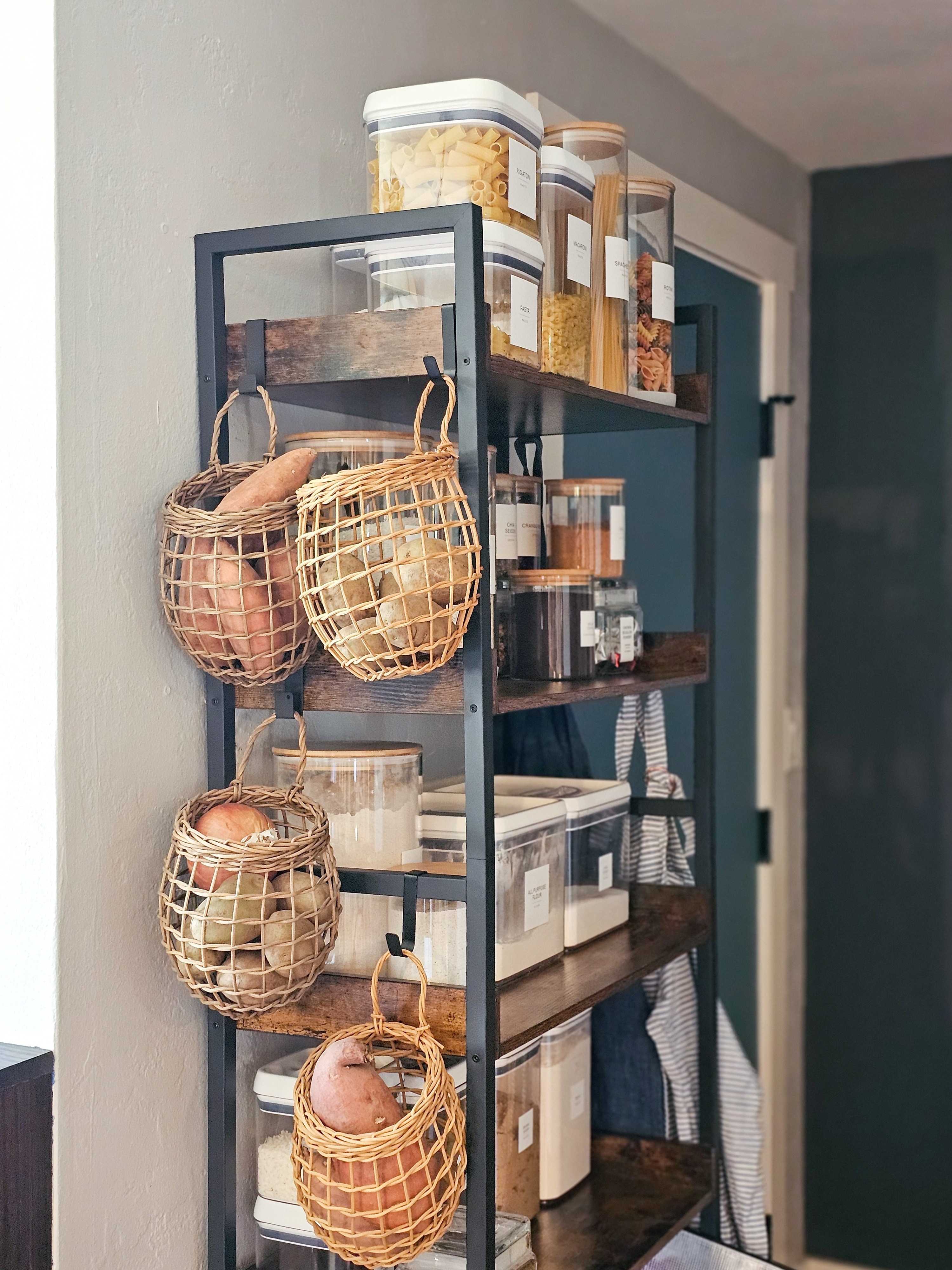 Nothing like some pretty storage in the kitchen! This affordable shelving unit works perfectly inour kitchen, providing some extra storage space in the small kitchen. And I just love those hanging baskets on the side for storing potatoes and onions.  

 #LTKHome