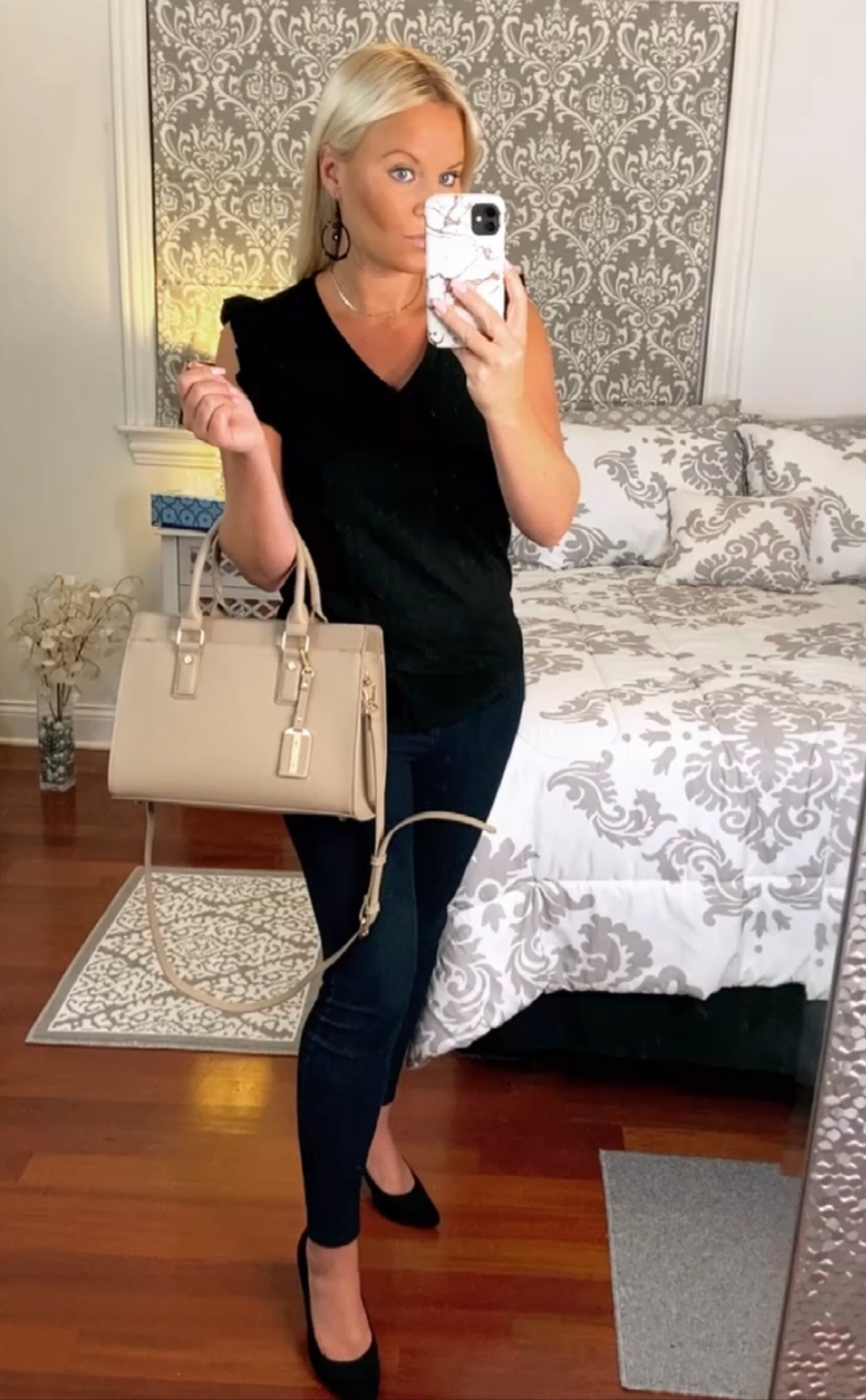 Comfy, classic style before cold fall days hit. This black ruffle top and nude bag are classics that will never go out of style.

#LTKitbag #LTKstyletip