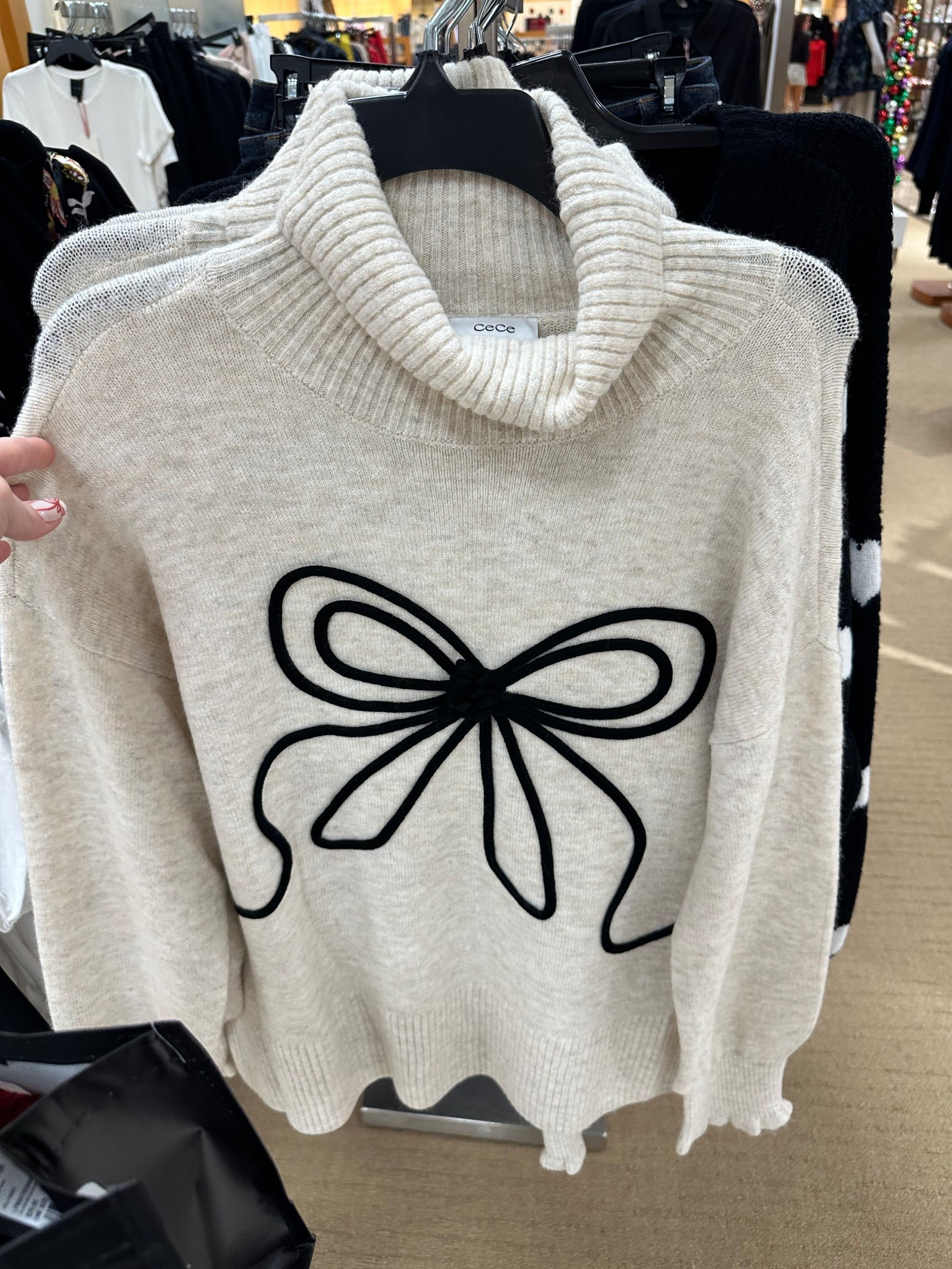 Cream knit turtleneck sweater featuring a bold black bow detail on the front. Cozy, soft, and effortlessly chic, this neutral sweater is perfect for fall and winter outfits. Easy to dress up or down with jeans, trousers, or skirts for a polished everyday look



#LTKGiftGuide #LTKHoliday #LTKgrwm