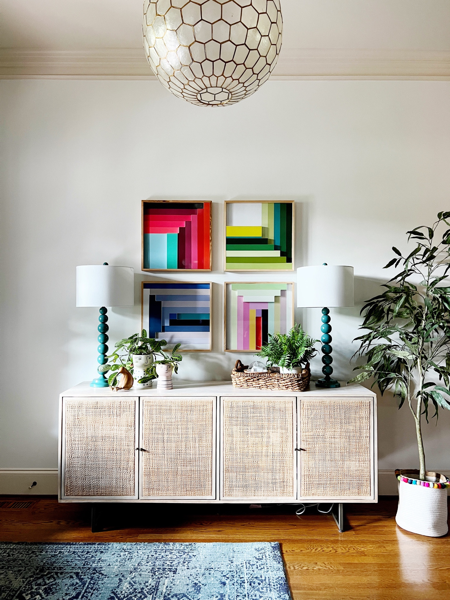 Colorful entryway, cane console table, pottery barn, Smith and Noble, four hands, west elm, console table, colorful art, faux olive tree, Grandin road, Serena and Lily, capiz pendant light 

#LTKhome