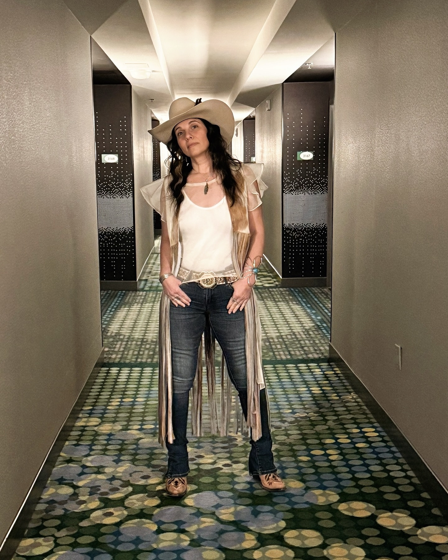 🔥 NFR Review - Outfit #3 🔥
Rodeo at its highest level meets haute couture vibes! Channeling casual perfection with this cowhide fringe vest by @westerlyusa , paired with classic denim and chic Ariat booties. Elevating it all with a touch of silk organza for that Alexander McQueen flair. Effortless, bold, and made for the arena lights. ✨

Western style, but make it couture .

Boots 7 | Jeans 26 | Hat 7 | Vest OS
 
Jewelry @thepirateandthegypsyjewelry 

#NFRStyle #HauteCowgirl #WesternChic #WesterlyUSA #AriatStyle #AlexanderMcQueenInspired #CowhideFringe #DenimAndSilk #RodeoElegance #WesternFashionista #NFROutfitInspo #fyp #thepirateandthegypsy

#LTKSaleAlert #LTKOver40 #LTKParties