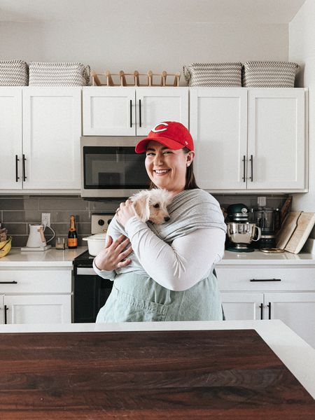 free people leggings, free people tee, white long sleeve tee, cincinnati reds baseball cap, puppy carrier, dog carrier, apron, cutting board, kitchen aid mixer

#LTKhome #LTKfindsunder100 #LTKfamily