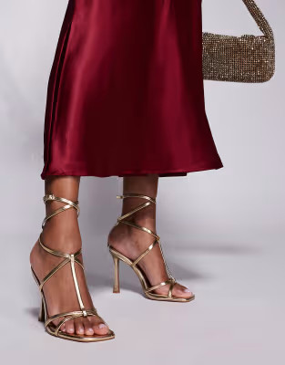 ASOS DESIGN Wide Fit Nobel caged high heeled sandals in gold | ASOS (Global)