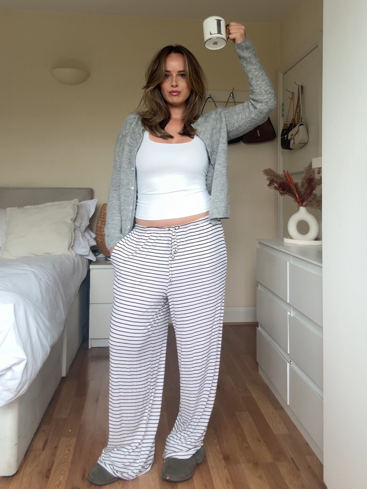 Comfy work from home outfit ☕️✨ Striped wide-leg lounge pants, soft grey cardigan, and a simple white tank for the perfect balance of cozy + put-together. Ideal for coffee runs, Zoom calls, or relaxing at home. Linking my exact pieces + similar affordable loungewear finds on LTK 🤍 #LTKfashion #LTKstyle #wfhoutfit #loungewearstyle #comfychic #cozyoutfitideas

#LTKautumn #LTKuk #LTKstyletip