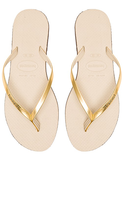 You Metallic Flip Flop in Sand Grey & Light Golden | Revolve Clothing (Global)