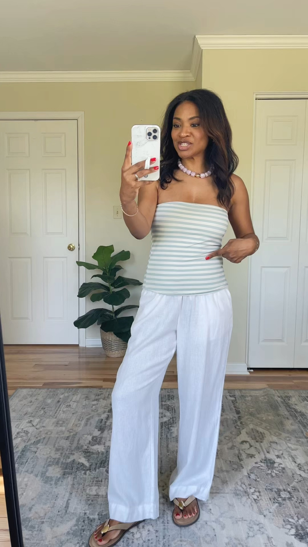 I’m wearing a size medium and the tube top. I’m wearing a size extra small in the linen pants, but I’m leaking similar ones cause these are from last year. ￼￼

 #ltksalealert #ltkswim #ltkover40

