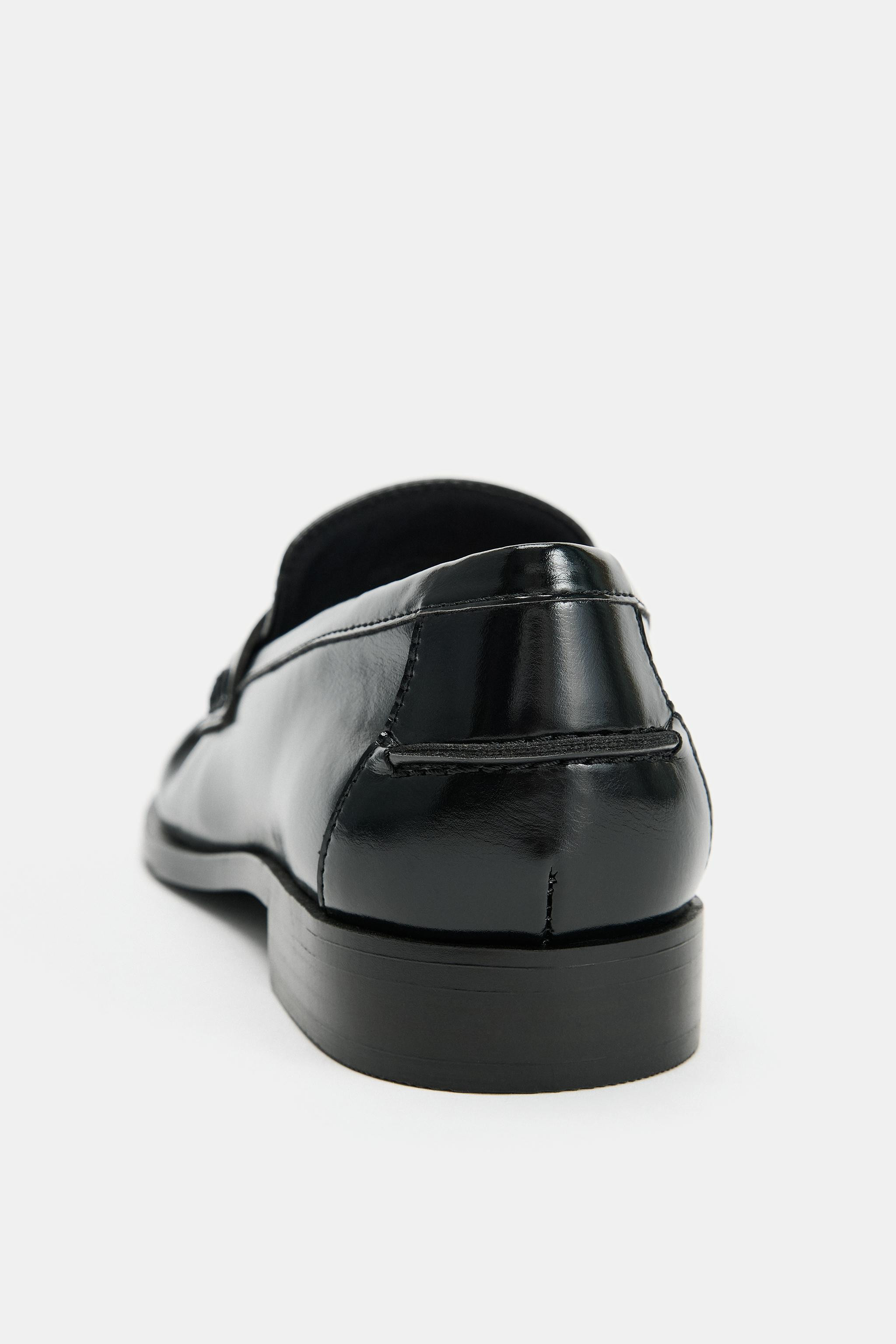 Patent-effect loafers. Featuring gathered detailing on the front. Penny strap and raised vamp. Fi... | Zara US