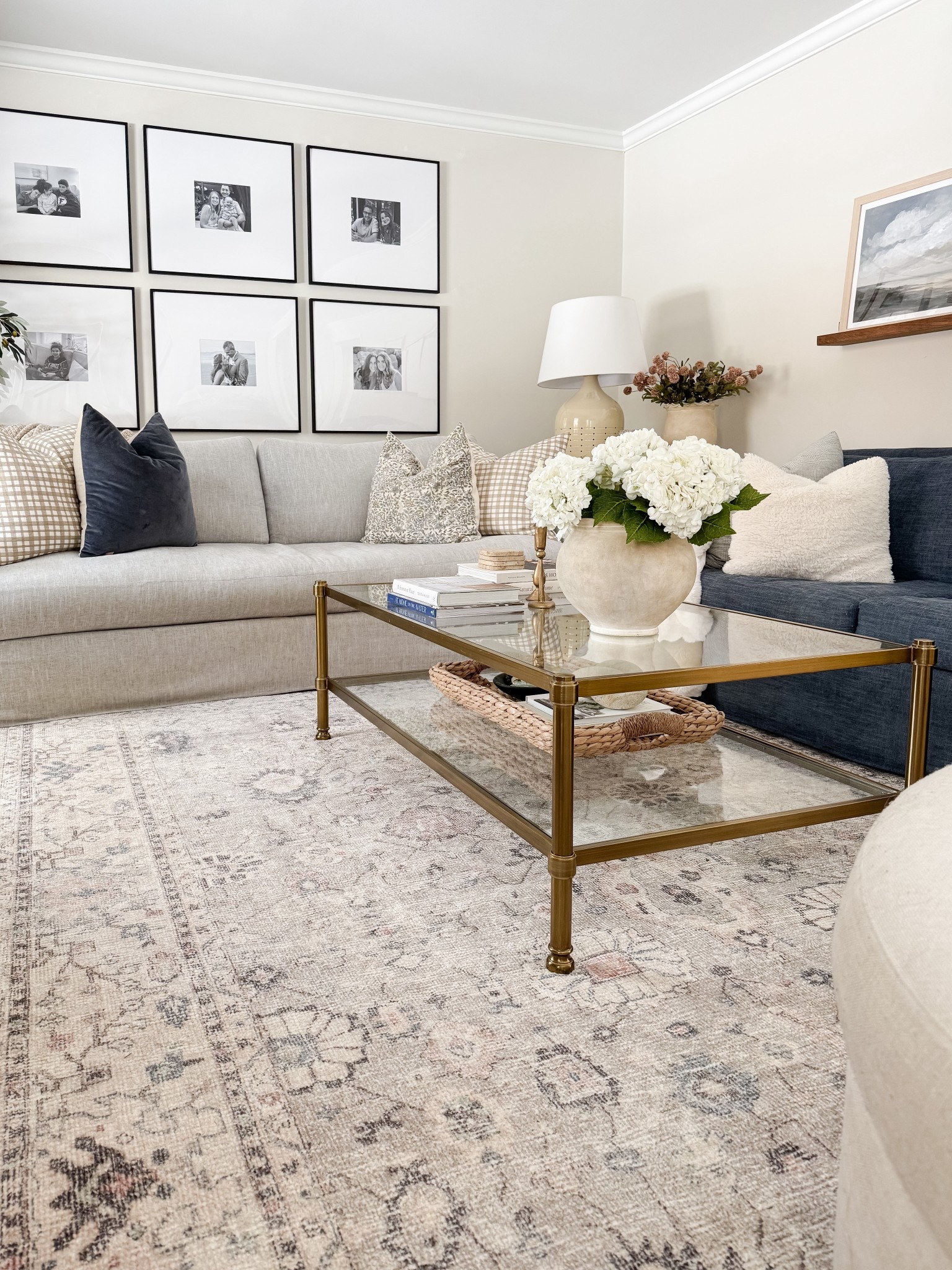 Coastal living room styled with neutral throw pillows, textured ivory rug, faux florals, and layered sofas for a relaxed high end coastal look.

coastal living room decor, neutral throw pillows, textured ivory rug, faux floral decor, layered living room styling, coastal home decor, neutral sofa styling, coffee table florals, light coastal interiors, sherricalnanhome

#LTKHome