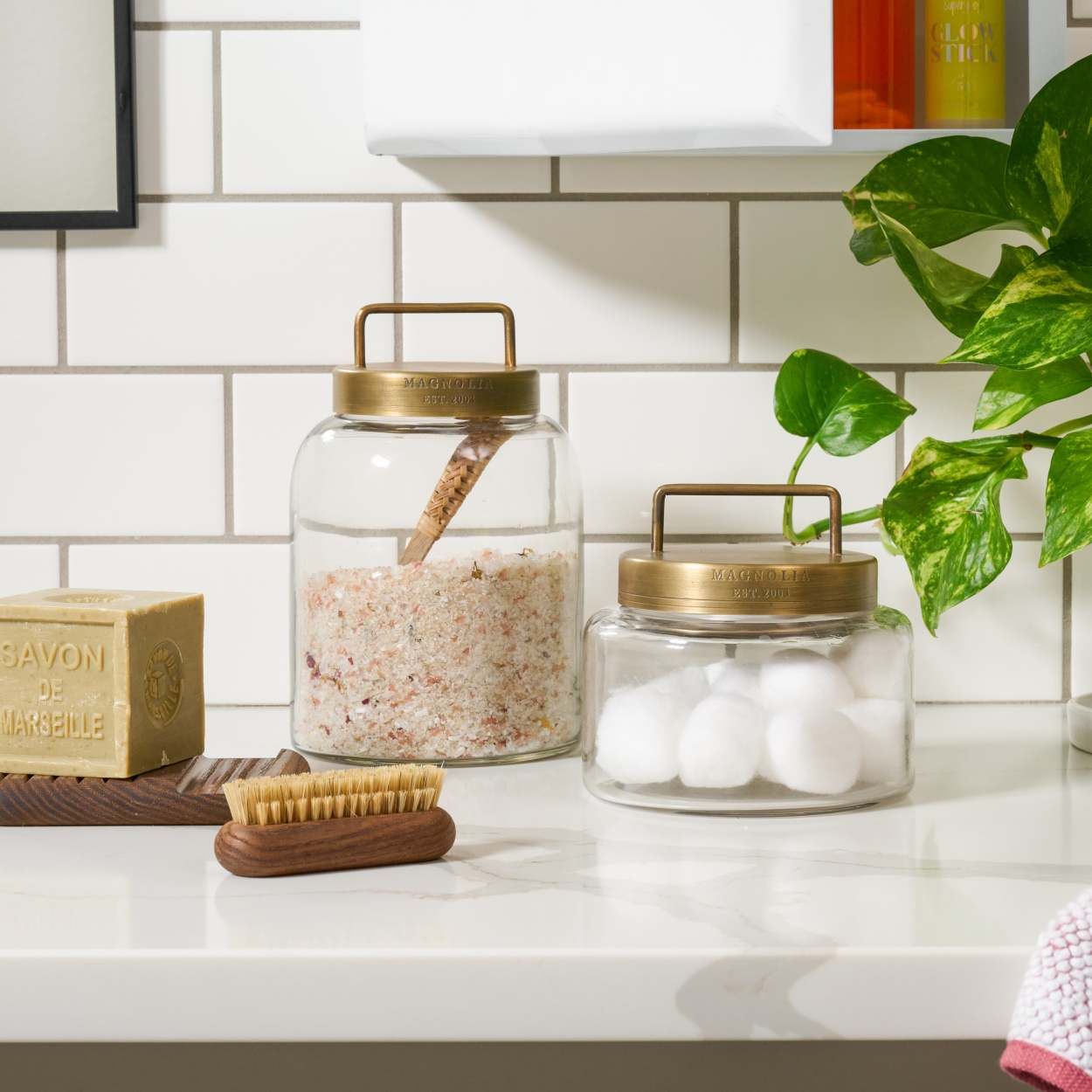 Keep your bathroom organized with our exclusive Antique Brass and Glass Canister. Available in th... | Magnolia