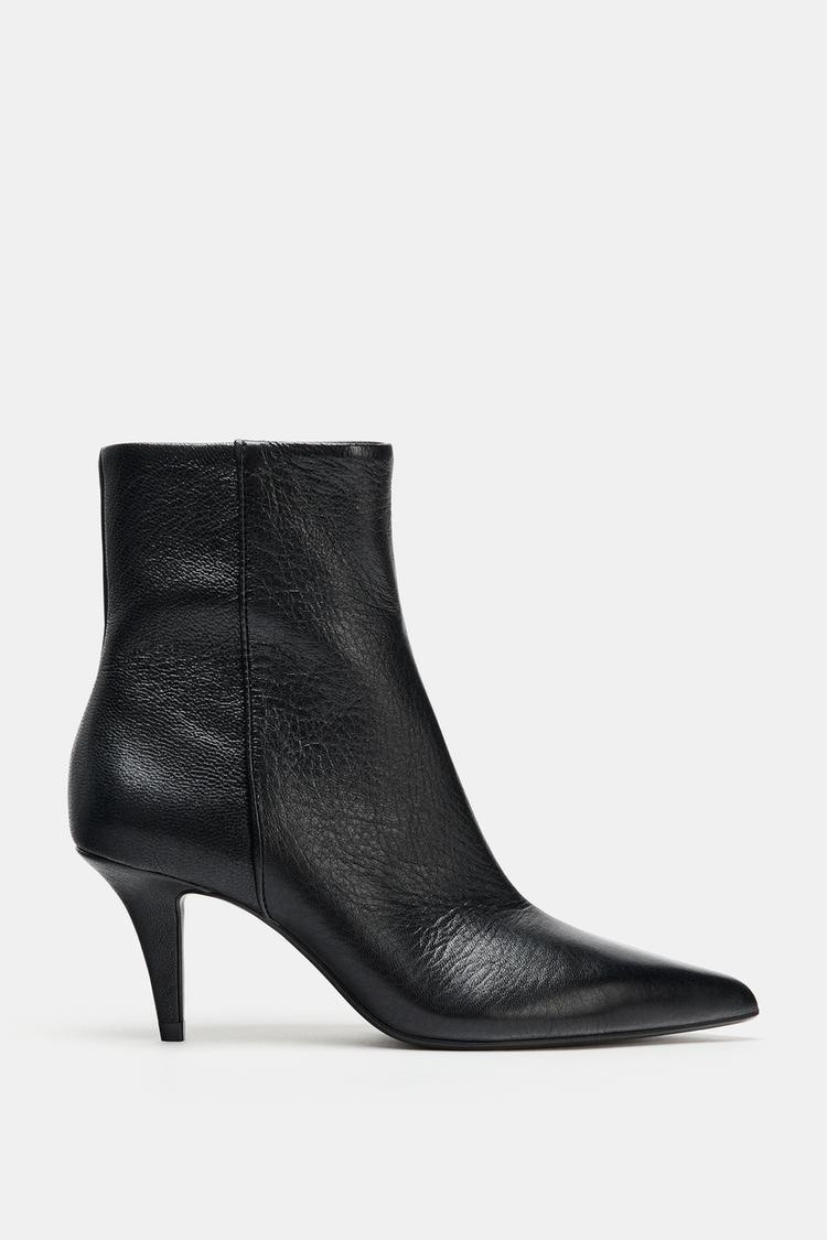 Leather ankle boots. Patent leather effect. Topstitching detail on the upper. Side zip closure. M... | Zara US