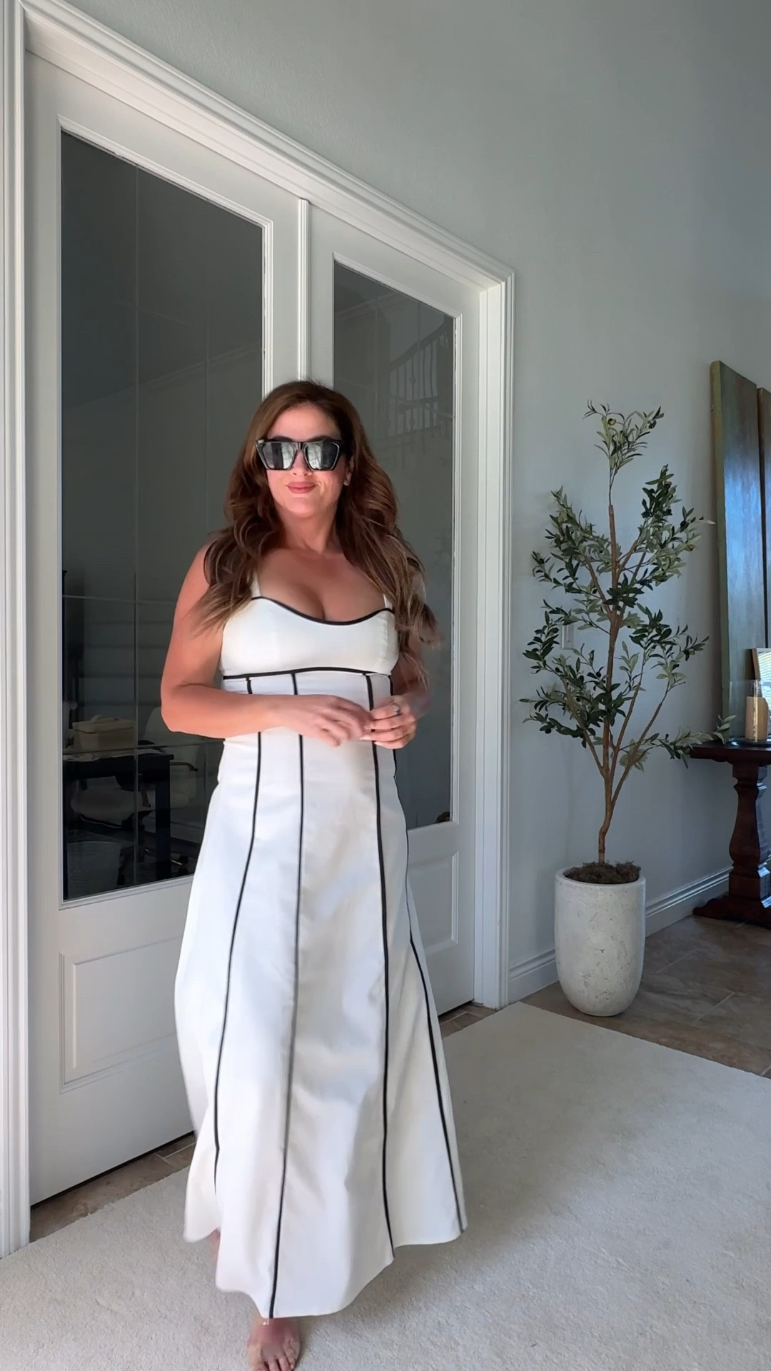 White dress with black detail. Adjustable straps and lined. Shown In medium .

#LTKTravel #LTKOver40 #LTKSeasonal