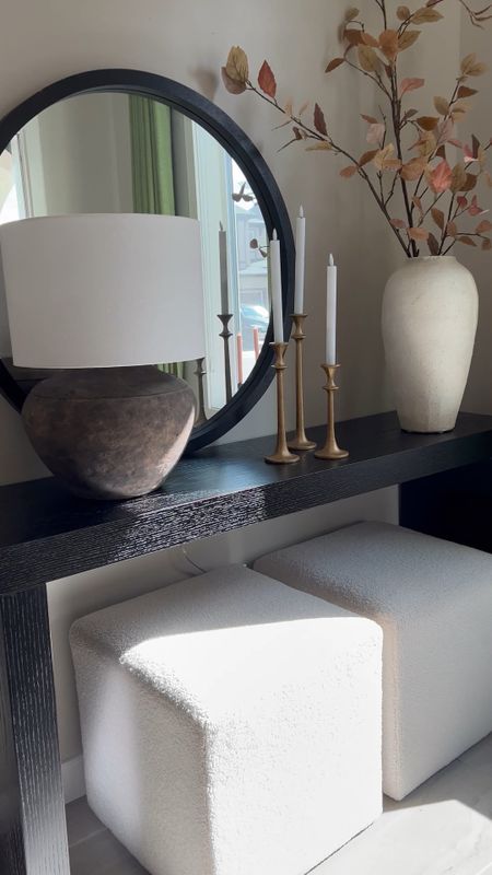 Hey Friend!😊Shop my black entryway console. I  love pairing it with a brown table lamp, black round mirror, large terracotta vase, cube ottomans, and brass candle holders.

#LTKstyletip #LTKhome #LTKsalealert