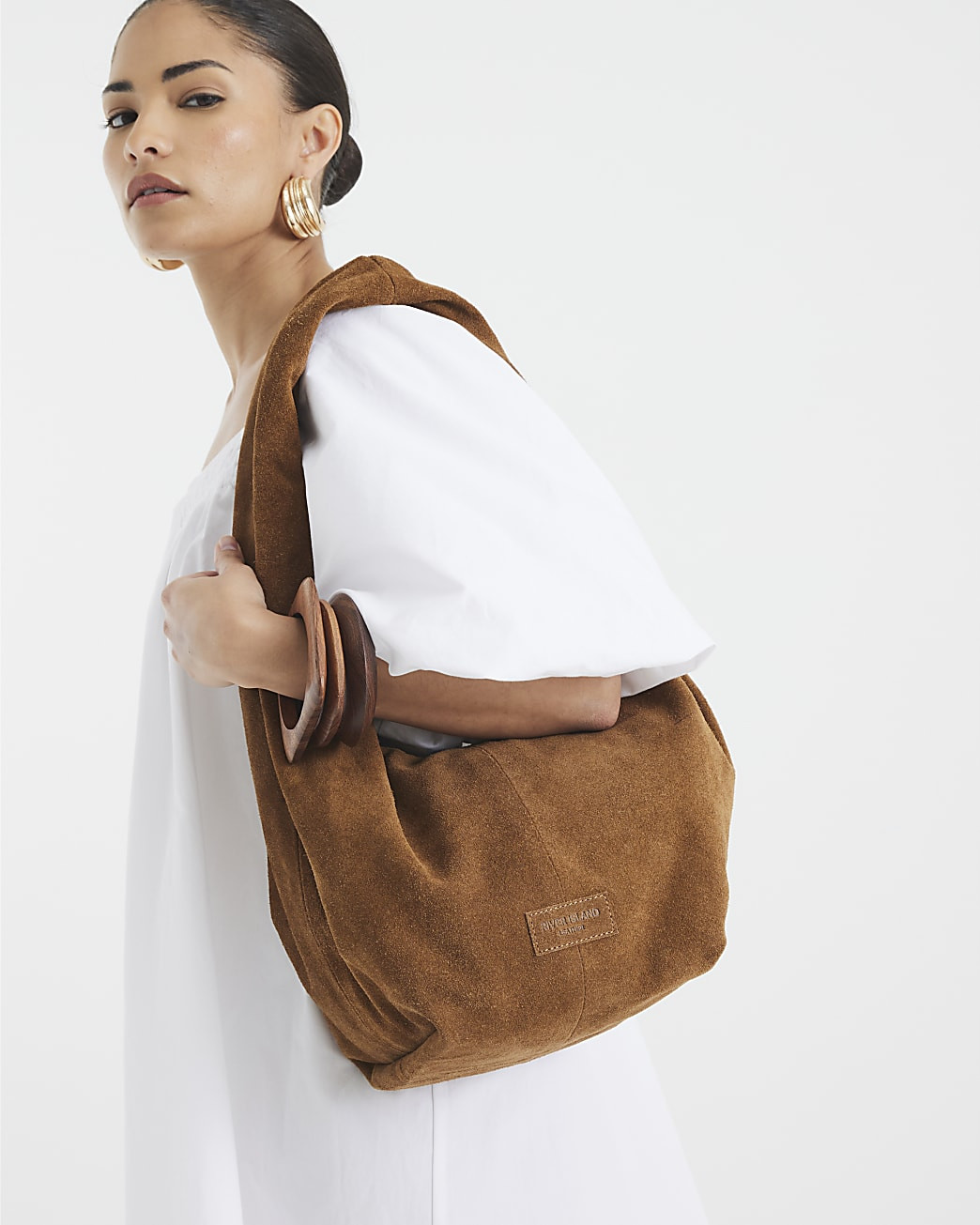 Brown Suede Twist Shoulder Bag | River Island UK & IE