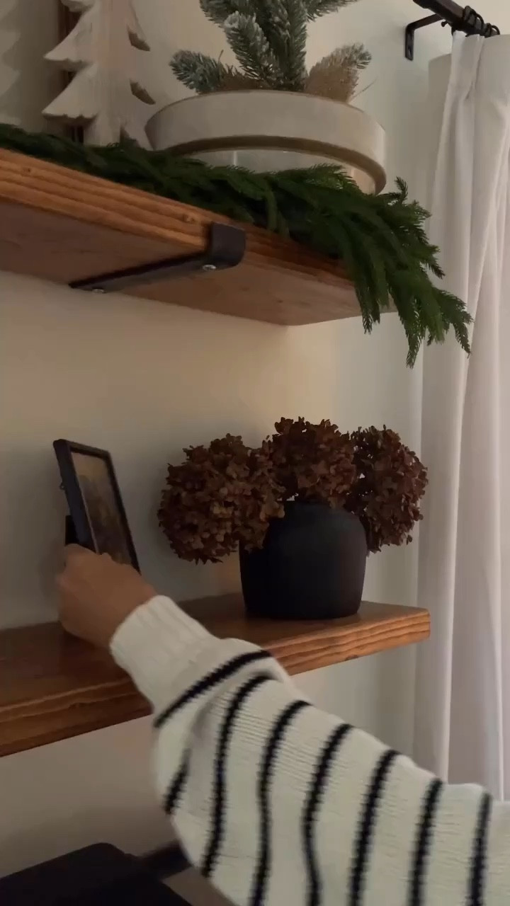 My coffee bar styling for Christmas mixing old with new.  

Garland.  Antique brass accents.  Black vases.  

#LTKHoliday #LTKHome #LTKWatchNow