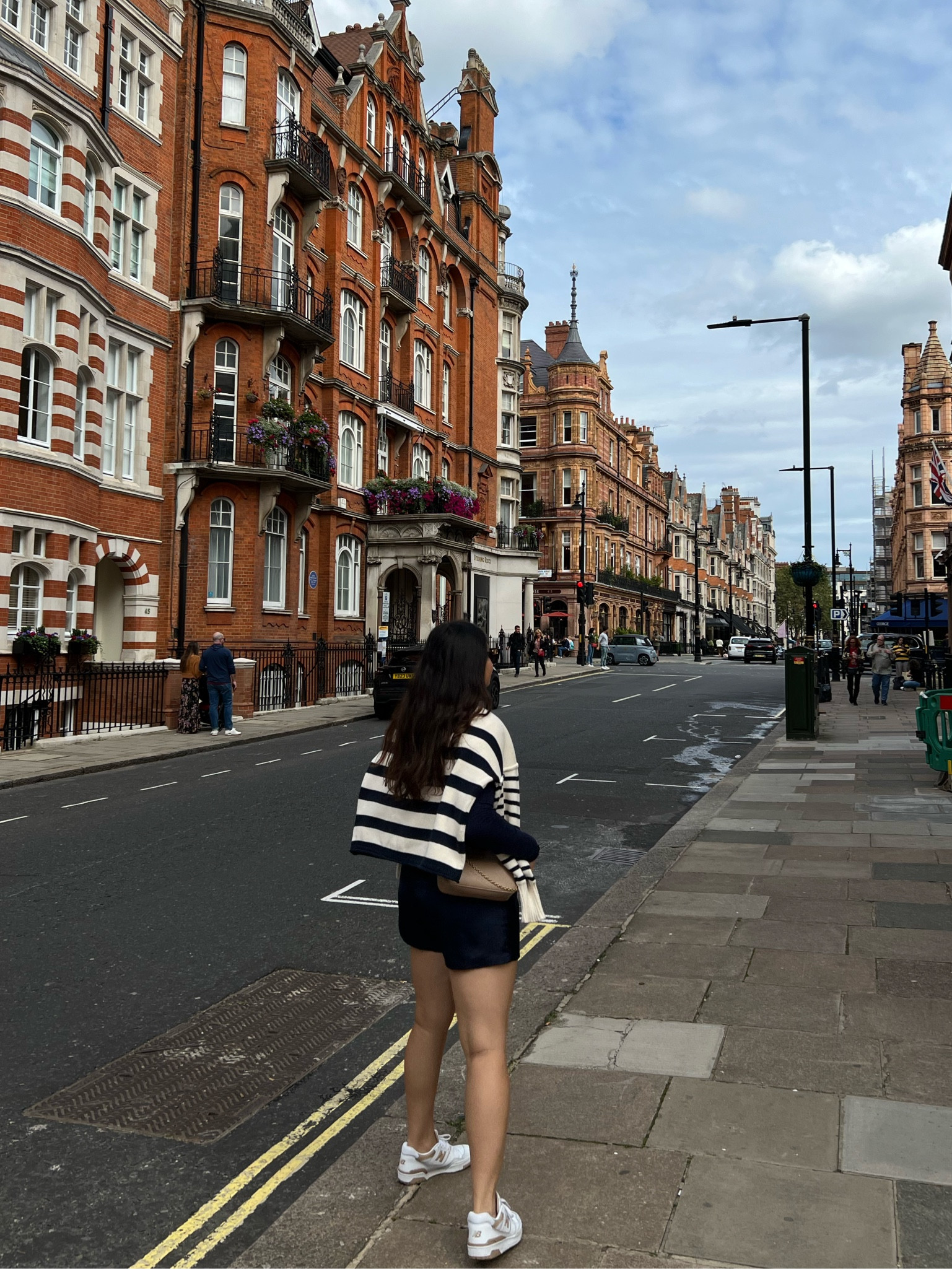 Outfits I wore in London. I love this outfit because it was stylish and chic but also comfortable. The satin shorts are a game changer and can elevate any outfit - and they are so comfy! I’m wearing size M. 

New balance 550s are TTS. 

Navy outfit; fall outfit; striped sweater, neutral sneakers, travel outfit 

#LTKmidsize #LTKtravel #LTKxMadewell