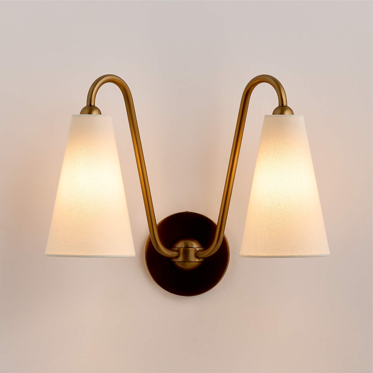 Everton Brass Double Wall Sconce Light with White Fabric Shades | Crate & Barrel | Crate & Barrel