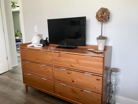This dresser goes perfectly with the mid century lines in this client’s bedroom renovation.  

Wayfair dresser.  Bedroom furniture.  Mid century dresser.  Wooden dresser.  

#LTKfamily #LTKhome #LTKstyletip