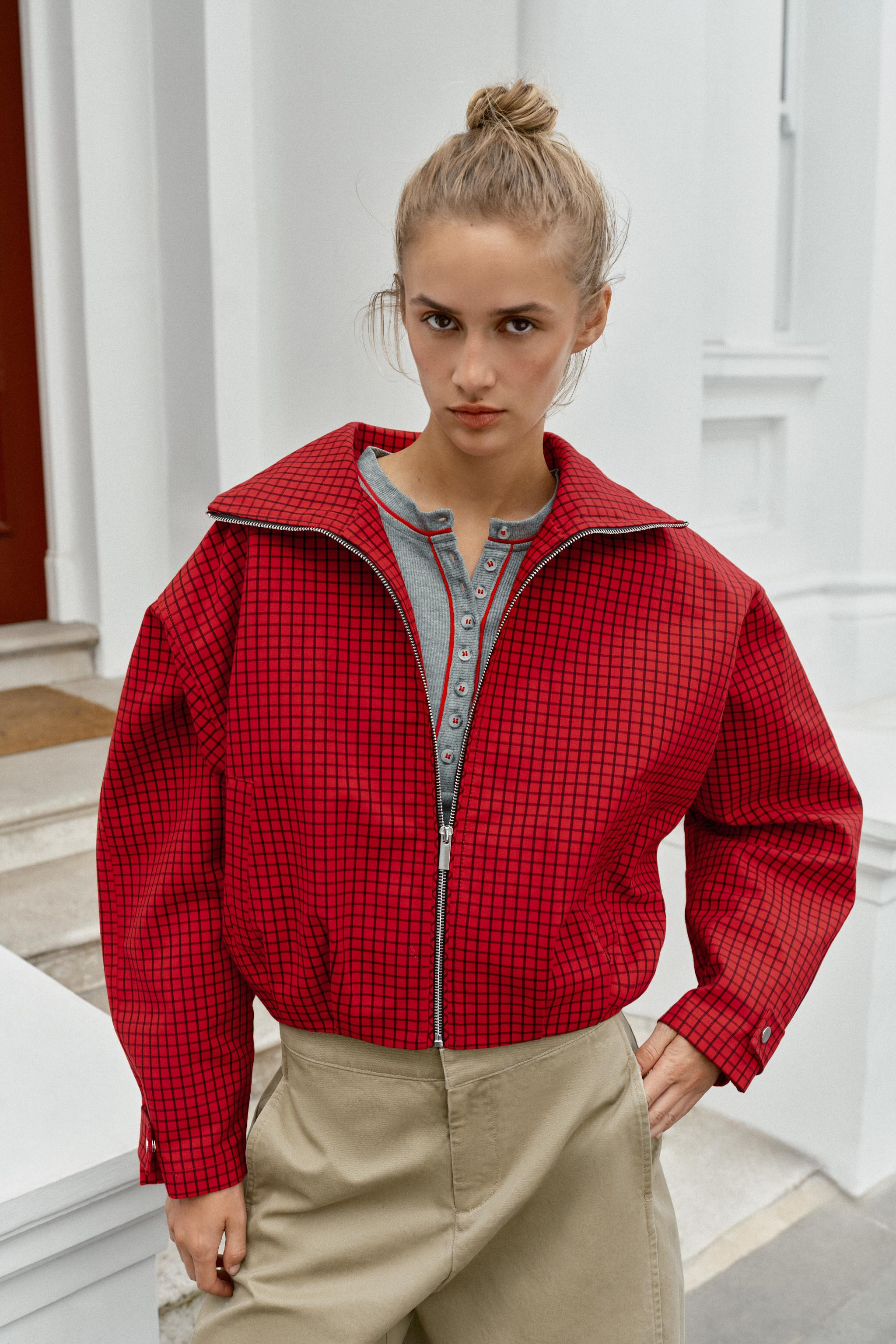 Bomber-style jacket with a high collar and long sleeves. Adjustable cuffs with snap-button tabs. ... | Zara US