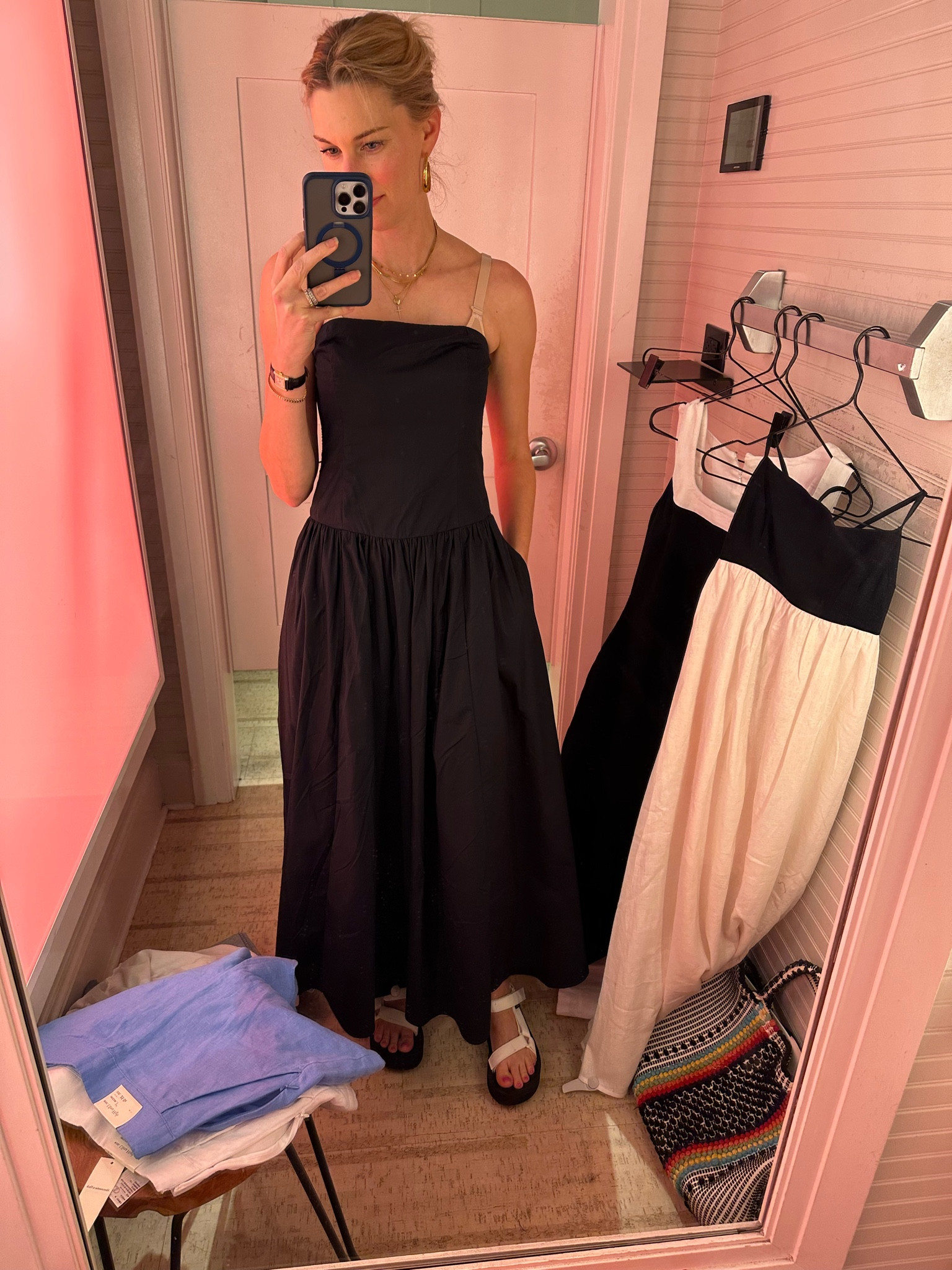 I’ve also worn this dress a ton this summer! I’ve worn it casually with my Teva sandals, and I’ve worn it with gold sandals to make it a little more dressy! It’s a great find and also very comfortable! I usually wear a bandeau bra with it. 
I’m wear an xs in this dressing room picture, but I purchased the xxs. 
I’m wearing an 8 in the sandals. I usually wear an 8.5. 