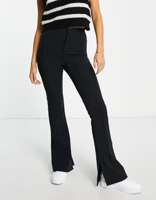 Bershka split hem flared pants in black | ASOS (Global)