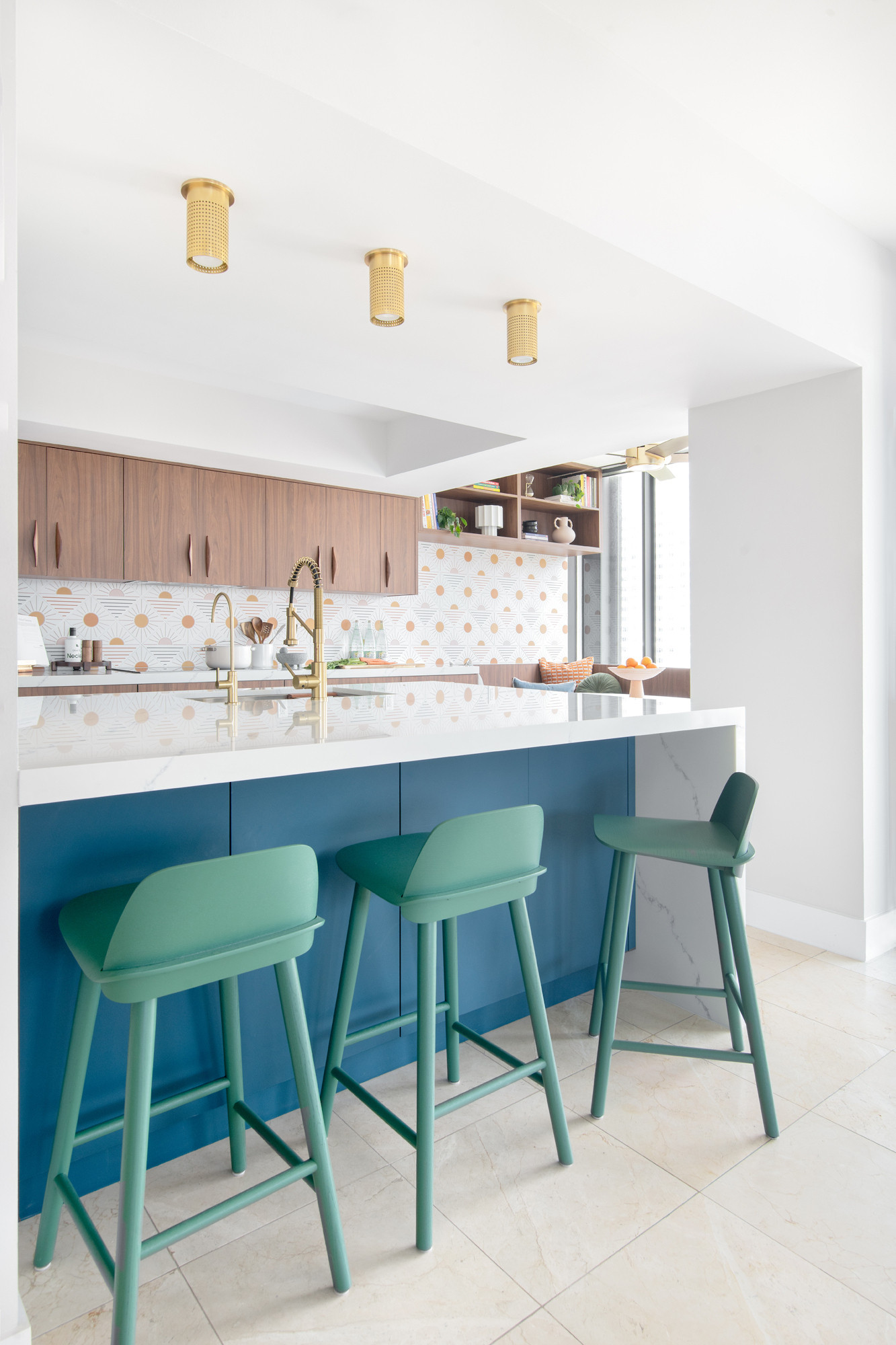 Color, texture, and function all in one. 
This modern kitchen proves that bold choices (hello, teal barstools + patterned backsplash) can still feel timeless when balanced with warm wood and clean counters. 

 #LTKHome