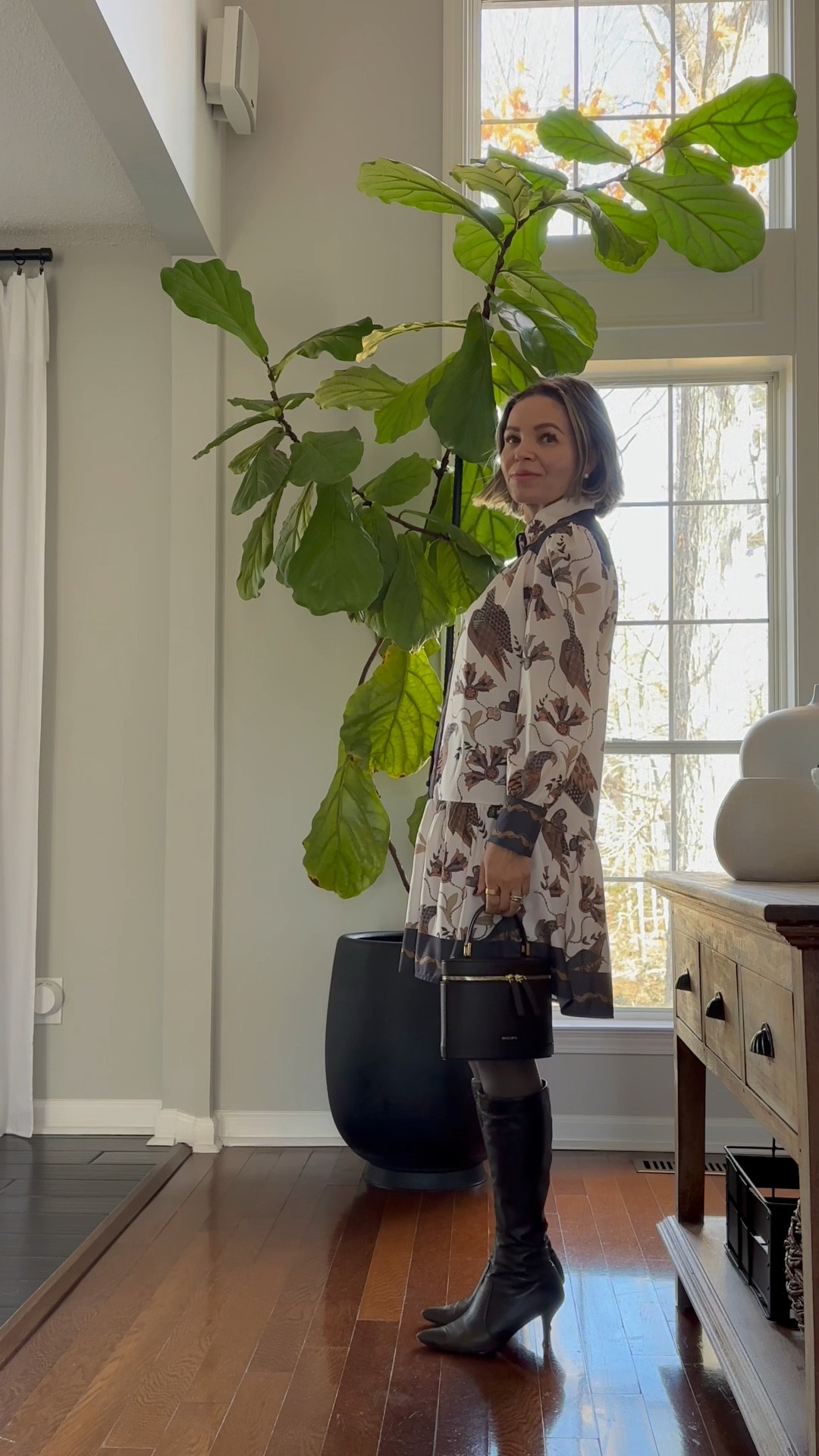 Flowy  dress paired with stockings, knee high boots , brown bag and faux fur coat 

#LTKHoliday #LTKgrwm #LTKGiftGuide