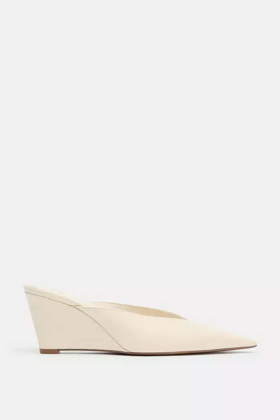Slingback heeled shoes. Mule style. Stitching detail on the body. V-neckline. High wedge heel. Po... | Zara US