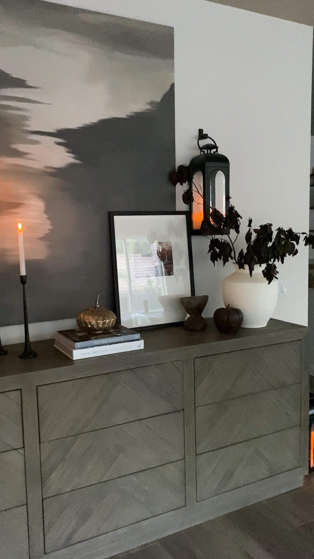 Fall home decor. Fall sideboard styling. Fall stems. Halloween decor. Large vase. Textured vase. Frame with mat. Black lantern. Black candlesticks. Faux candles. Pumpkin decor. Wooden pumpkin. 

#target #targethome #marshalls 

#LTKhome #LTKSeasonal #LTKHalloween