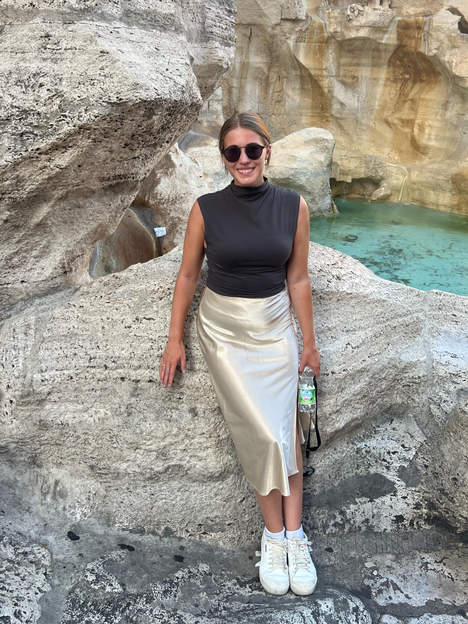 Travel outfit , Italy outfits, tourist outfits, vacation outfits, Rome outfits, Europe outfits, white sneakers, silk skirt, midi skirt, staple clothes, plain top

#LTKSeasonal #LTKstyletip #LTKeurope