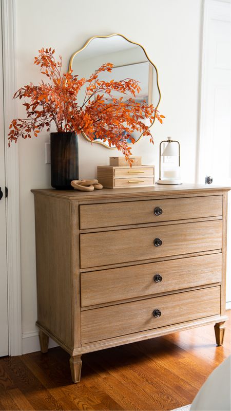 Pretty fall home decor for your bedroom, including candle warmer, scalloped mirror, decorative boxes, faux leaves