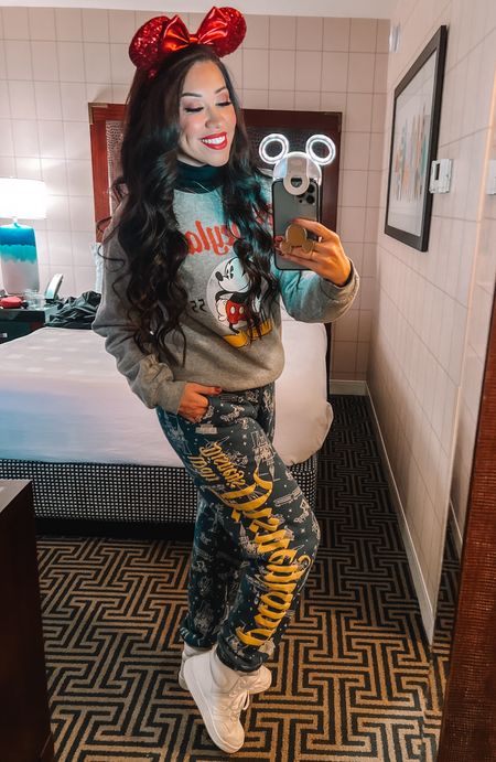 It was my Disney day with my besties and all their kiddos! It was very cold in the morning so I was layered up! Haha! My pants are a small for reference and still give me that baggy look, but I could only find a medium. #DisneyOutfit #DisneyOutfitInspo #DisneyOOTD 

Outfit Details:
• Mickey Mouse crewneck sweatshirt from Disneyland in a Med.
• Disneyland sweatpants in a Small.
• Black turtle neck in a small. 

#LTKSeasonal #LTKMostLoved #LTKstyletip