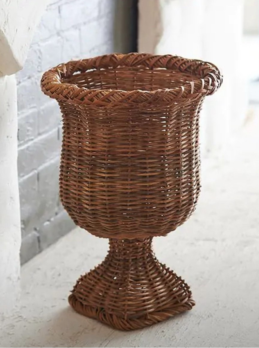 Measuring a bit over one-and-a-half feet in height, this is a great piece filled with a fern or a large floral arrangement when lined with a vessel for water. 

SPECIFICATIONS
Specifications
season	everyday
made of	rattan and iron
dimensions	13" x 19" h

SHIPPING INFORMATION
Free shipping 

#LTKHome