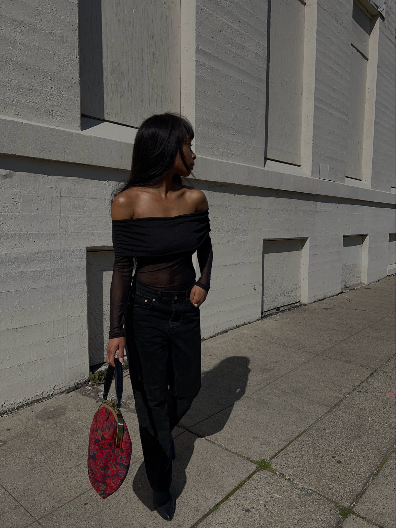 black top, black pants, booties, red bag.

#LTKstyletip