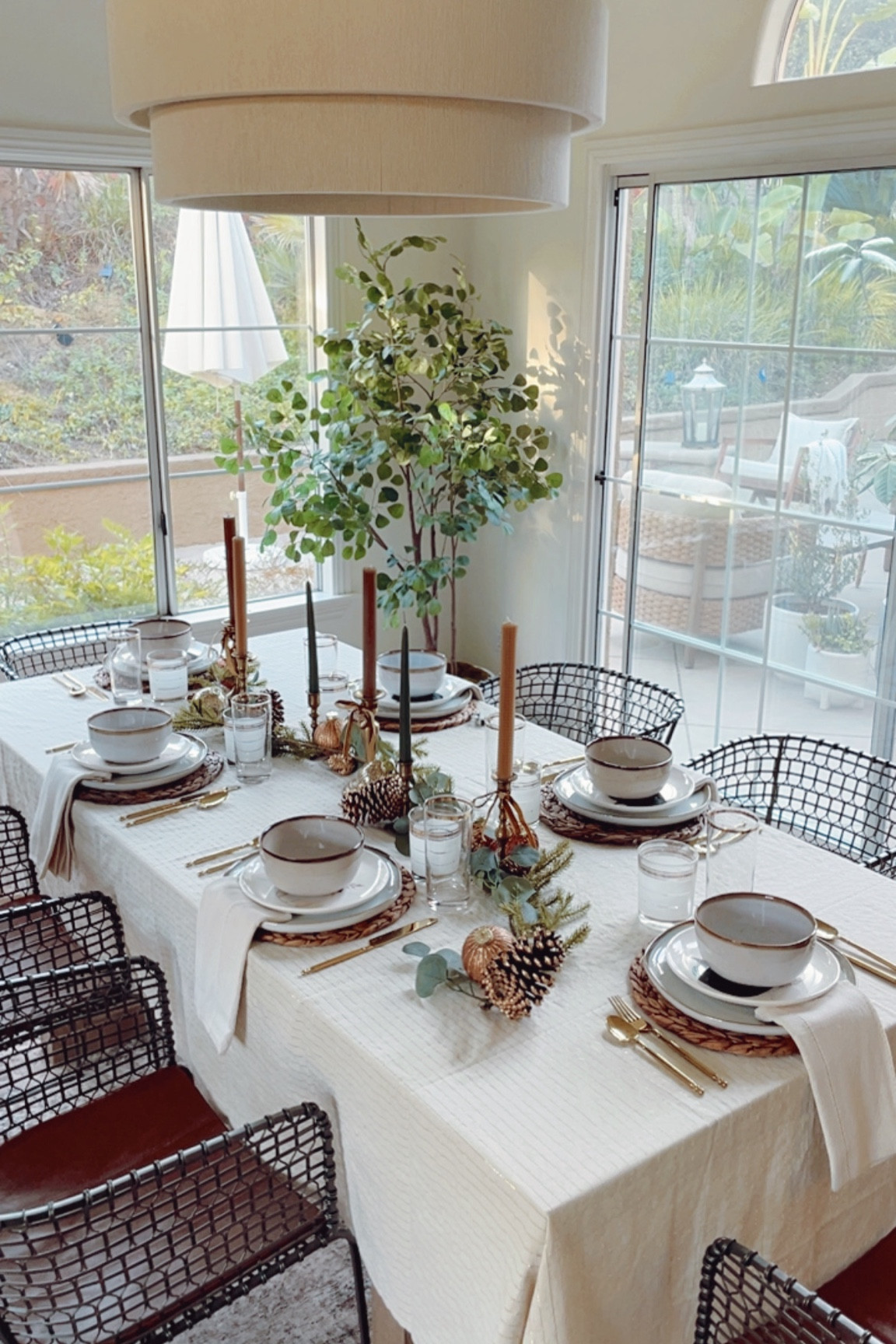 Winter Tablescape with garland centerpiece. Using mostly greens and neutrals with pops of gold on my holiday table. 👏🏻

#glassware #tabledecor 

#LTKHome #LTKSeasonal #LTKHoliday