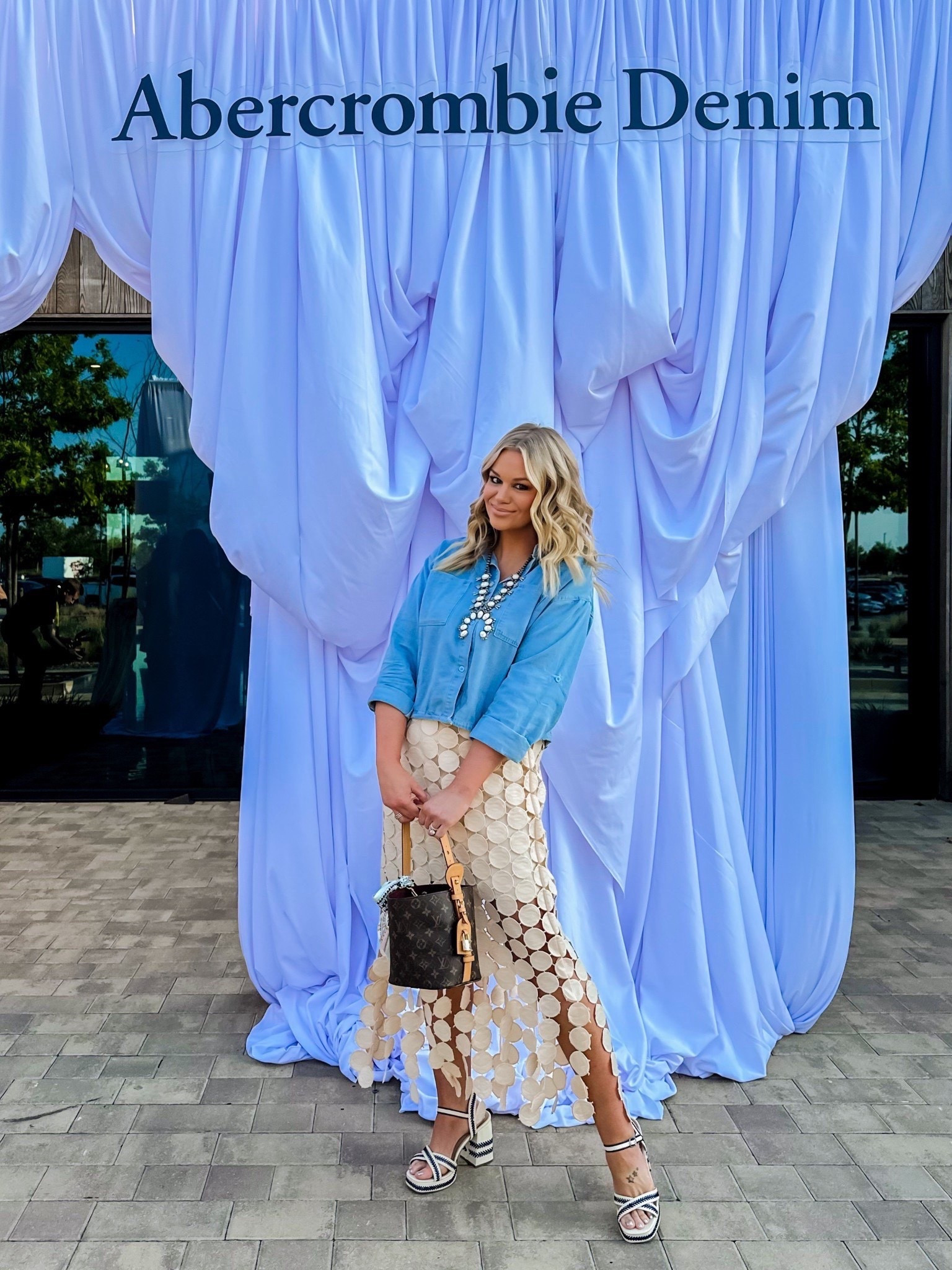 My favorite skirt is on super sale and it’s true to size I’m wearing a medium. The top has a drawstring and I pull the shirt to Ware. The drawstring isn’t showing anymore and it’s a really cute crop denim shirt. ￼