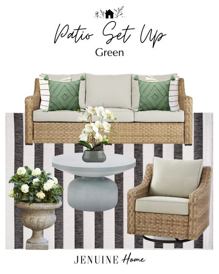 Patio set up. Patio couch set. Green classic porch. Concrete coffee table. Classic traditional planter pot. Black and white striped outdoor rug. Faux orchid decor  