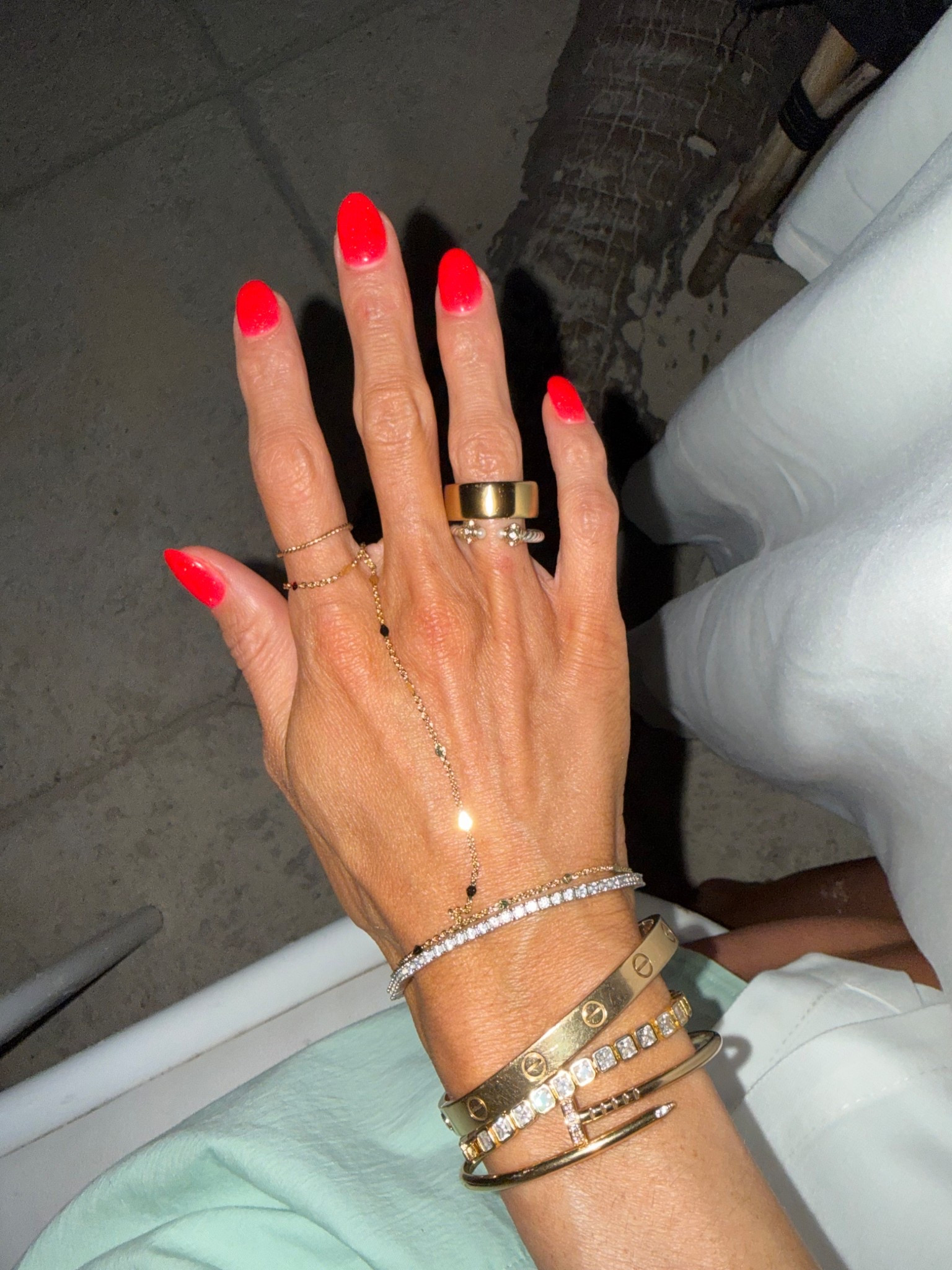 My told Oura ring I never take off! Layered with gold hand chain and tennis bracelets that look real 

#LTKOver40 #LTKSeasonal