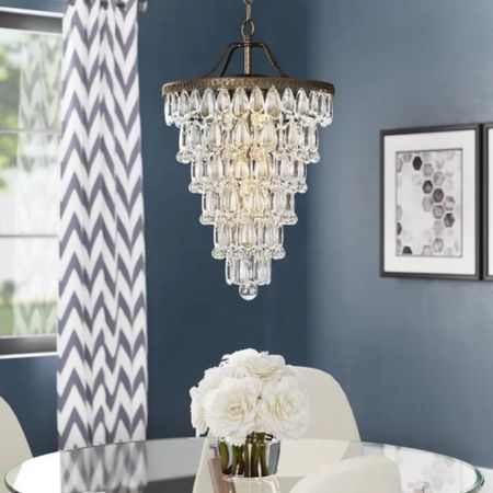 Shop crystal chandeliers! The Blaise 4 - Light Dimmable Tiered Chandelier is under $200.

Keywords: Crystal chandelier, dining room, chandelier, lighting, foyer, formal dining room

#LTKparties #LTKhome #LTKstyletip