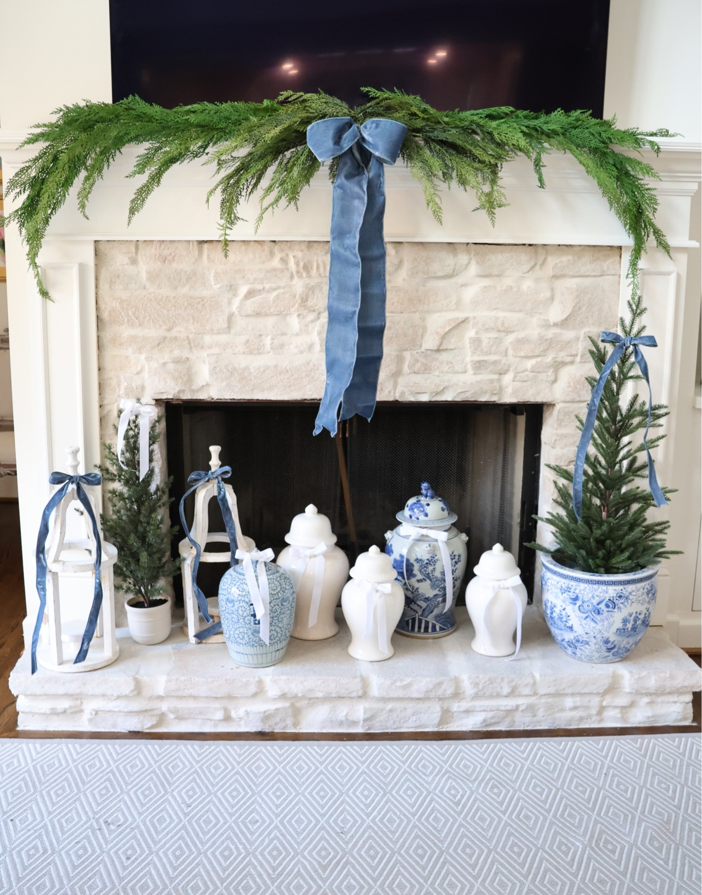 My EXACT Christmas mantel decor— this greenery won’t last long! It always sells out! And looks so realistic! Go ahead and order it before it sells out! 

Cedar swag and garland with a dusty blue velvet bow is my favorite! The exact tree is the large one in a basket and I put it in a chinoiserie pot! Grandmillennial blue and white holiday decor 🩵

#LTKHoliday #LTKhome #LTKfindsunder100