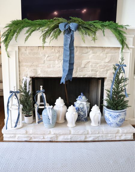 My EXACT Christmas mantel decor— this greenery won’t last long! It always sells out! And looks so realistic! Go ahead and order it before it sells out! 

Cedar swag and garland with a dusty blue velvet bow is my favorite! The exact tree is the large one in a basket and I put it in a chinoiserie pot! Grandmillennial blue and white holiday decor 🩵

#LTKHoliday #LTKhome #LTKfindsunder100
