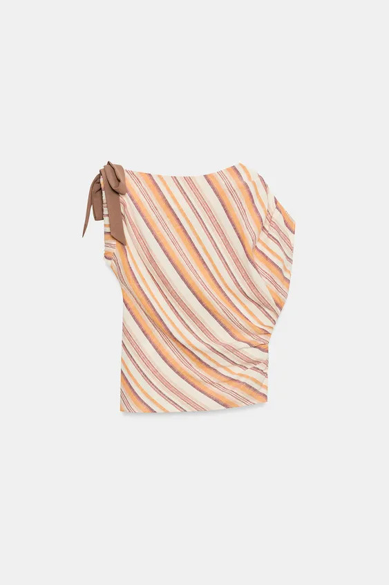 Top crafted from linen and metallic thread. Boat neckline and asymmetrical sleeves with tie detai... | Zara US