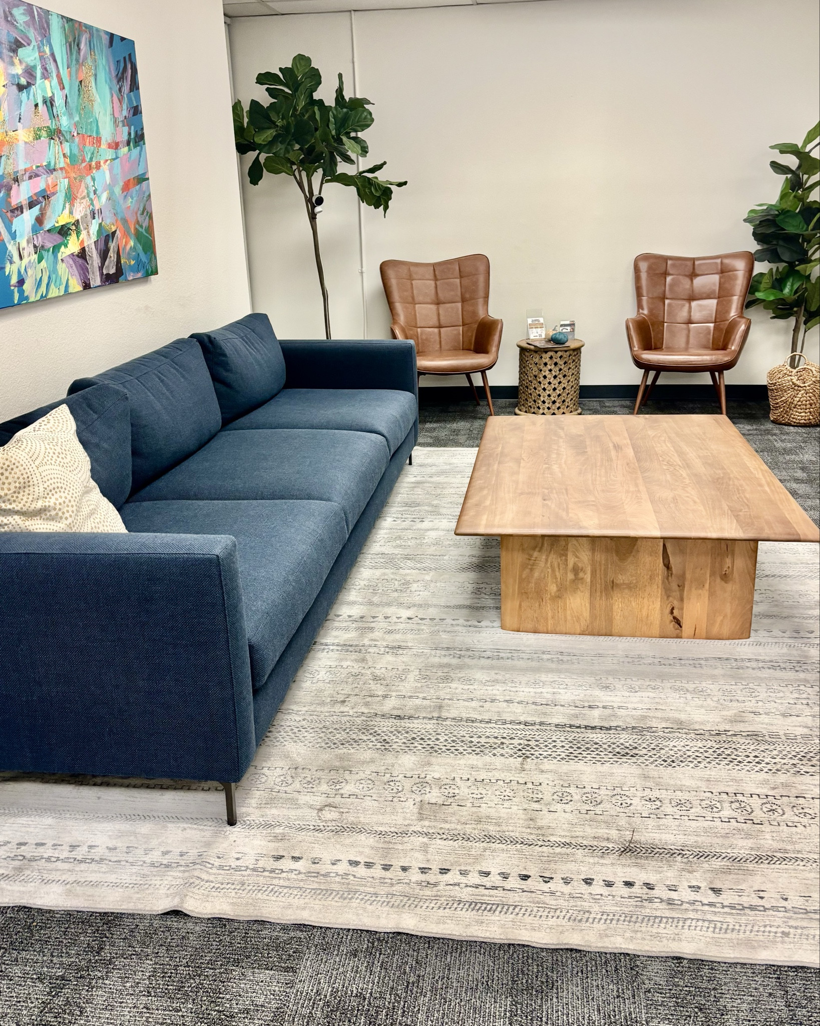 We gave a generic office cozy living room vibes at the Music Therapy Center of California.  An oversize sofa from Pottery Barn (contractor grade) and a large rustic coffee table from West Elm with a washable rug complete the look 👌

#LTKHome