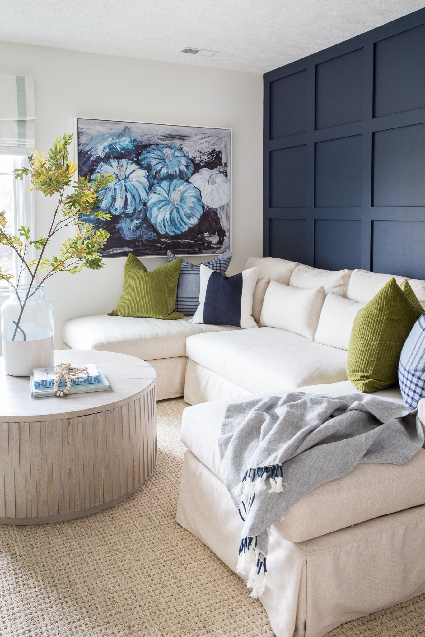 Our Omaha den decorated for fall and Halloween with our linen sectional, faux oak leaves, round fluted coffee table, navy blue suede and green pillows with blue pumpkin wall art.

#ltkhome #ltkseasonal #ltksalealert #ltkfindsunder50 #ltkstyletip #ltkfindsunder100 pumpkin decor, coastal fall decor living room decor, fall decorating ideas, linen sofa, slipcovered sectional

#LTKHalloween #LTKHome #LTKSeasonal