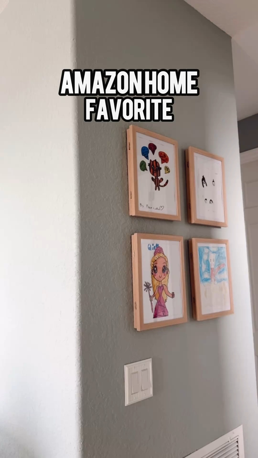 My favorite new addition to our home 🫶🏻 absolutely LOVE seeing the girls light up getting to show off their work… if you have sweet little artists too, this is the prettiest way to display it! I love that it keeps it from cluttering up the countertops and fridge, too. 🤭 The frames are gorgeous, come in different wood stain options and are under $30 for a two-pack! #amazonhome #amazonprime #amazonfind #amazonfavorite #homedecor 