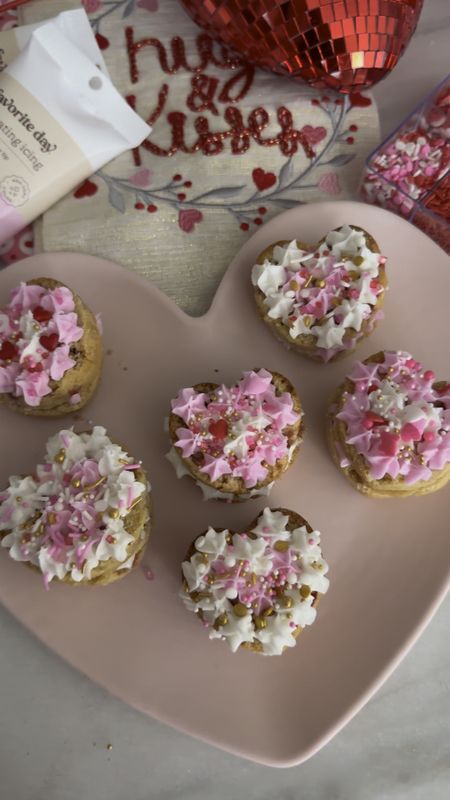 Strawberry Muffin Petit Cakes! These are perfect for a valentines or galentines party! 


For the strawberry muffins, here's a more specific breakdown:

- 2 C flour
-C sugar
-1/2 tsp salt
- 2 tsp baking powder
- 1/2 C milk
- 1/2 C vegetable or avocado oil
- 2 large eggs
- 1 tblsp vanilla extract
- 1 C fresh strawberries, diced

**Preheat** oven to 375°F (190°C).

Combine dry ingredients in a bowl, add wet ingredients together into a separate bowl. 

Pour wet mix into the dry mix and gently stir until combined (don’t over mix this!) 

Fold in your diced strawberries!

 I did overfill these a tad so I could cut the tops off! Bake for about 25 minutes 🤩


#targetvalentines #targetfood #valentinesrecipes #valentinesday 

#LTKkids #LTKparties #LTKfamily